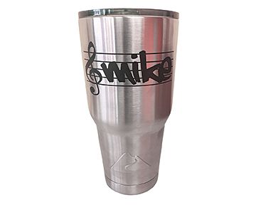 A stainless steel tumbler with a treble clef and the name mike on it.