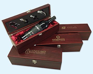 A bottle of wine is in a wooden box that says vanguard