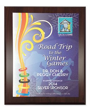 A plaque that says road trip to the winter games on it