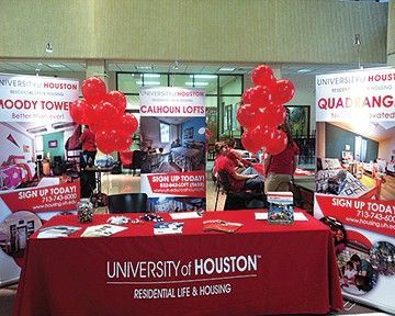 A table with a university of houston sign on it