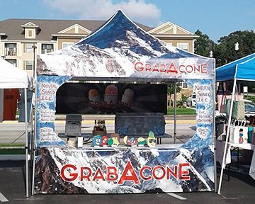 A grab a cone stand in a parking lot
