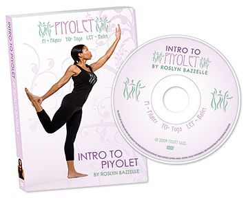 A woman is doing a yoga pose next to a cd.