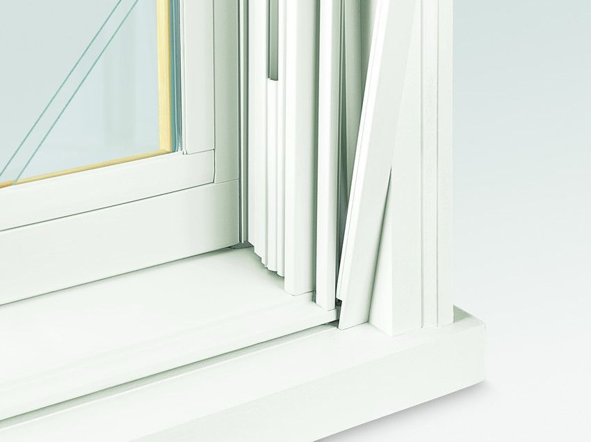 A close up of a white window on a white surface.