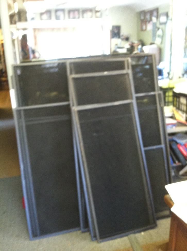 A bunch of screens are stacked on top of each other