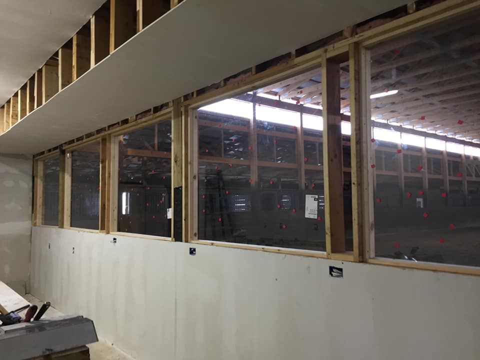 A building under construction with a lot of windows