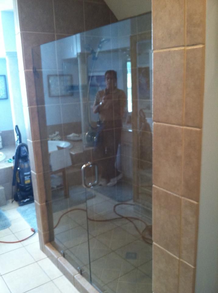A man is taking a picture of himself in a bathroom mirror