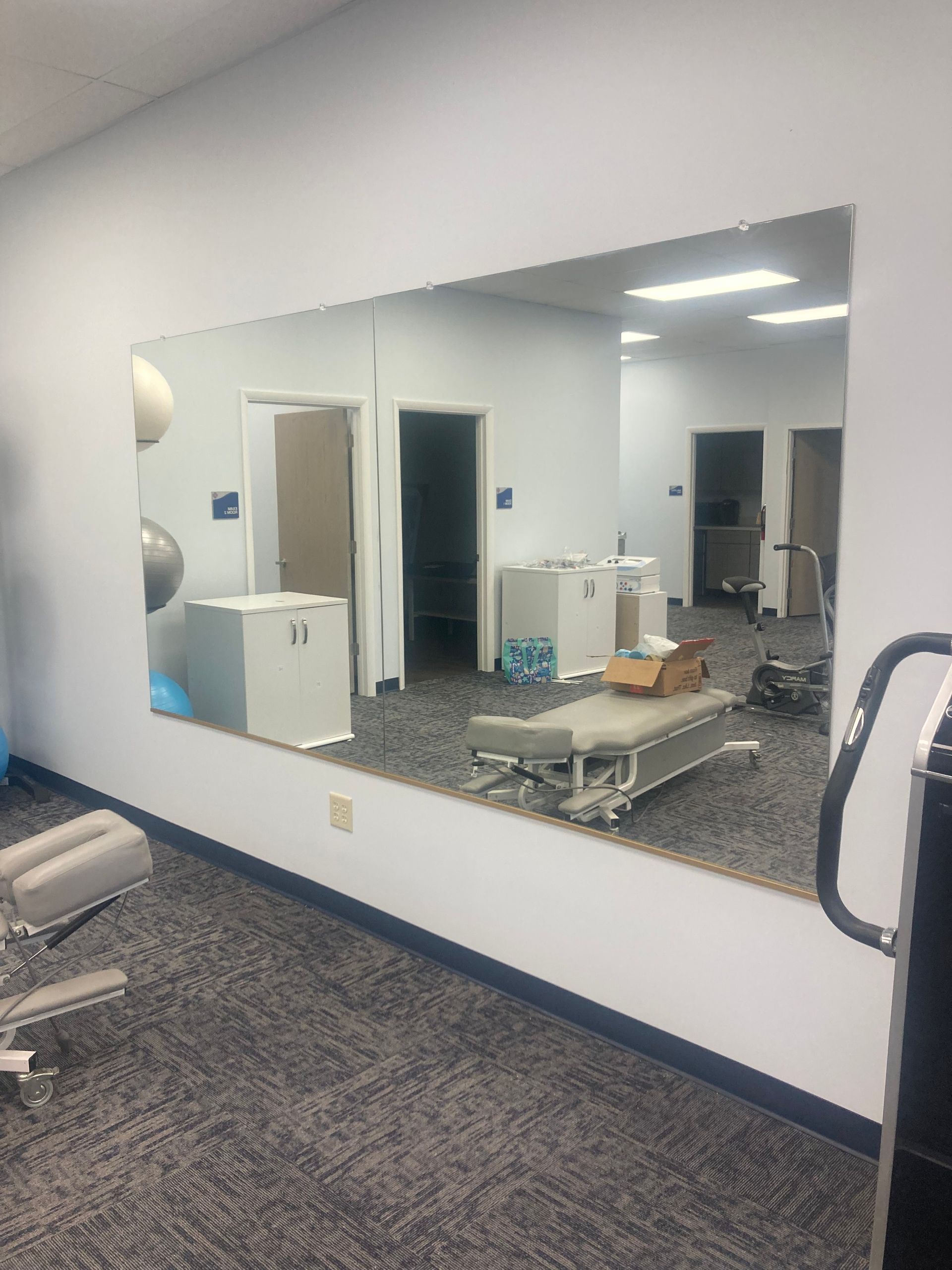 There is a large mirror in the middle of the room.