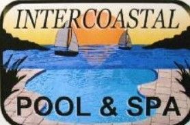 A sign for intercoastal pool and spa with sailboats in the ocean.