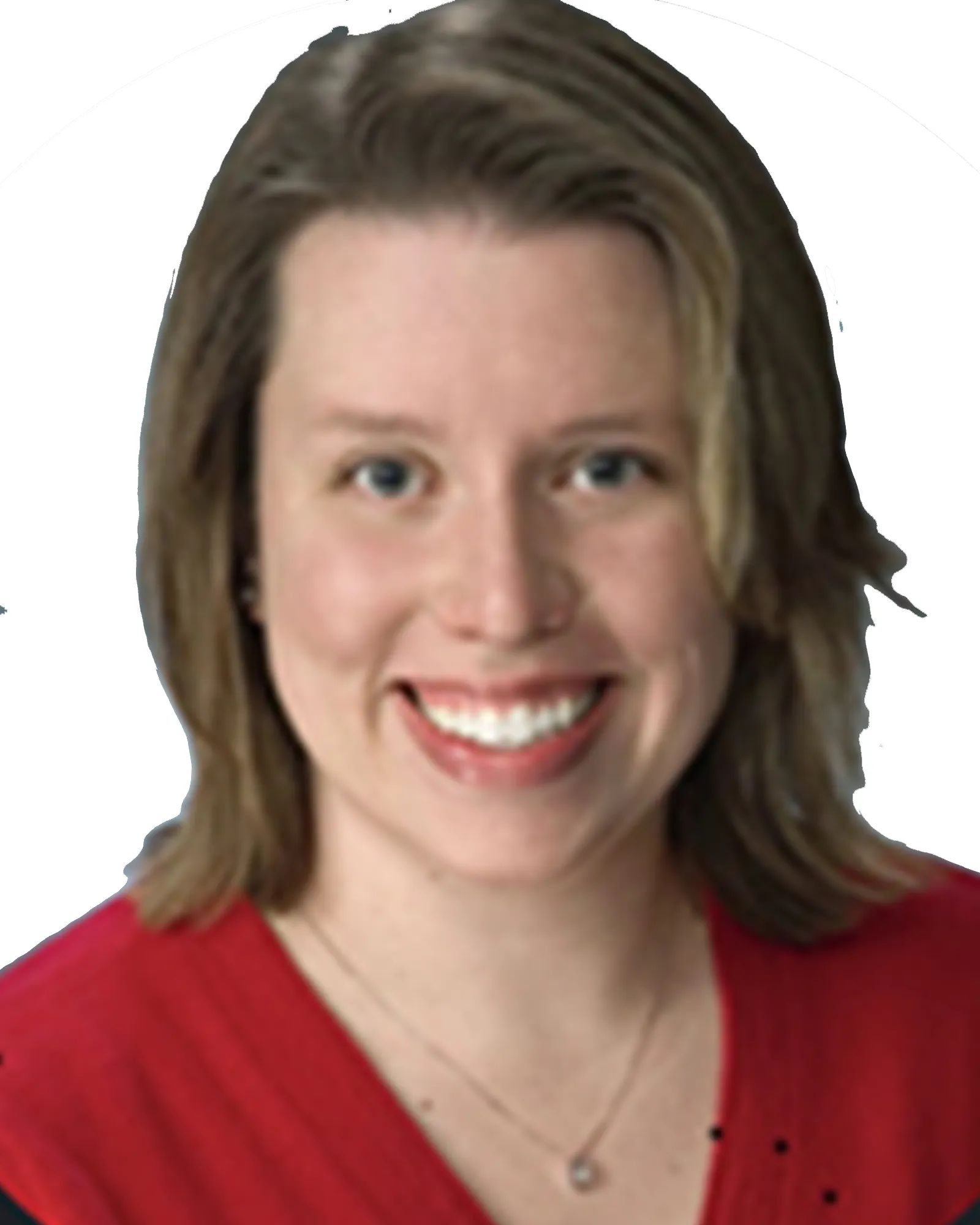 Woman with short blonde hair smiling, wearing a red top and necklace.