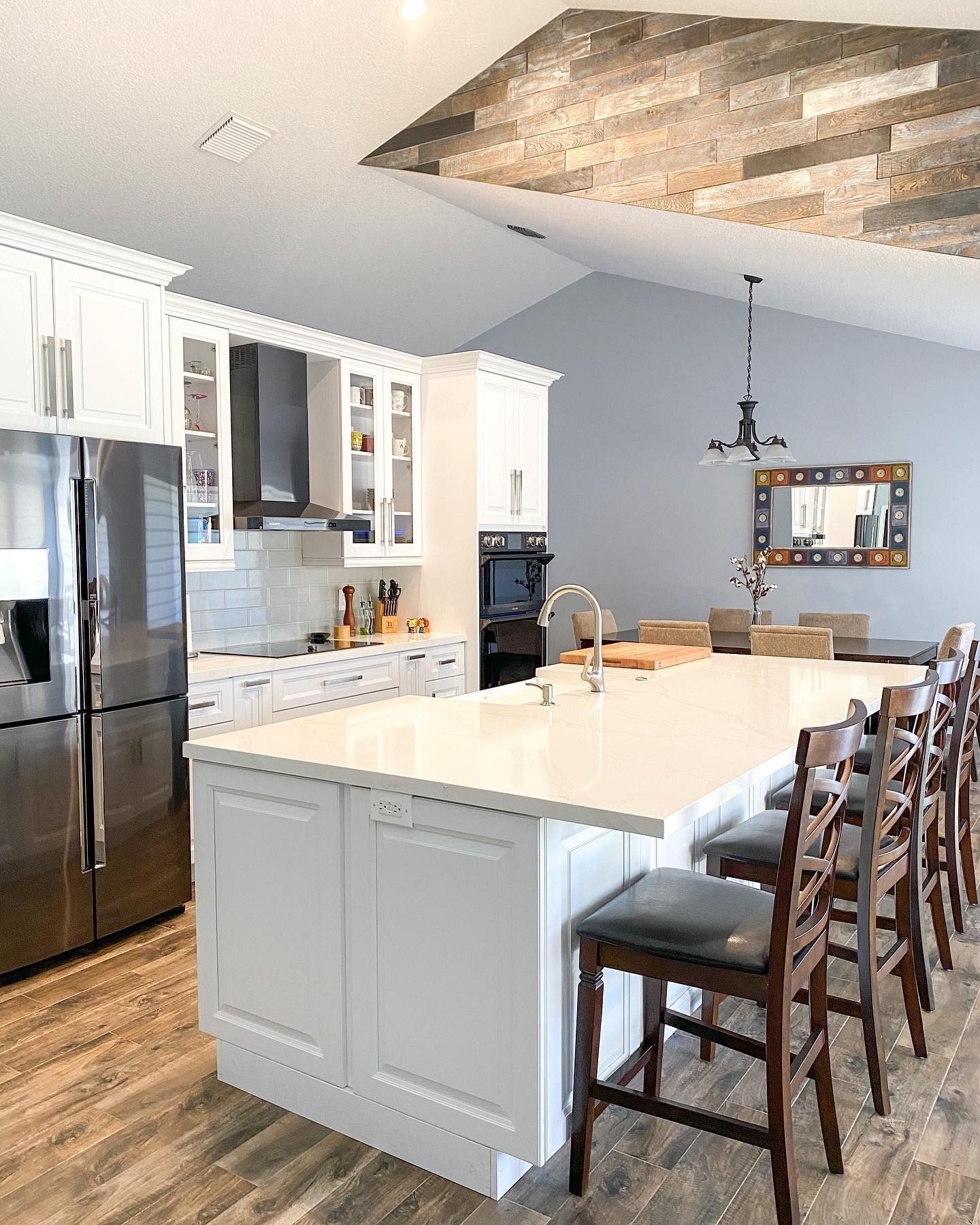 There is a large island in the middle of the kitchen.