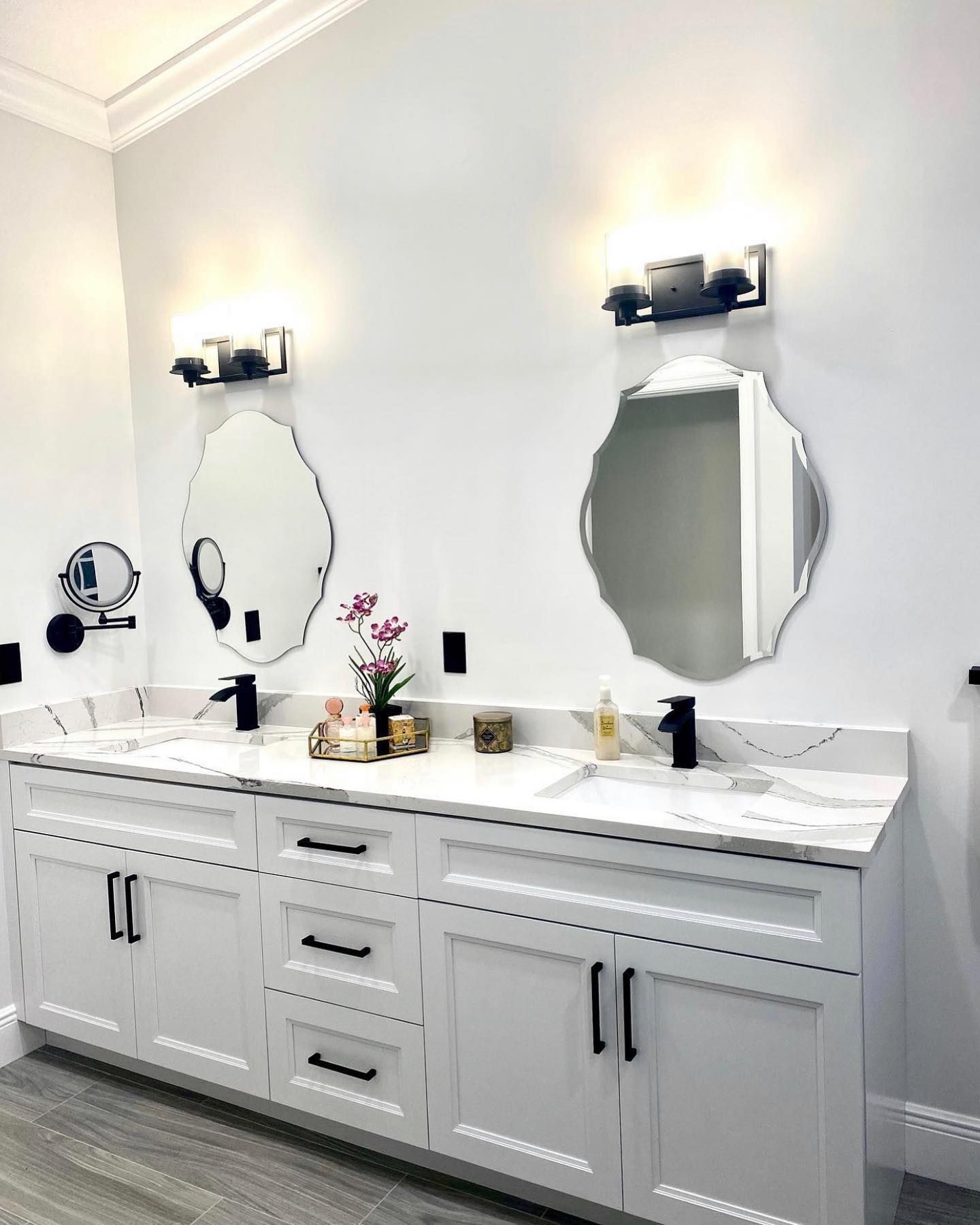 A bathroom with two sinks and two mirrors.