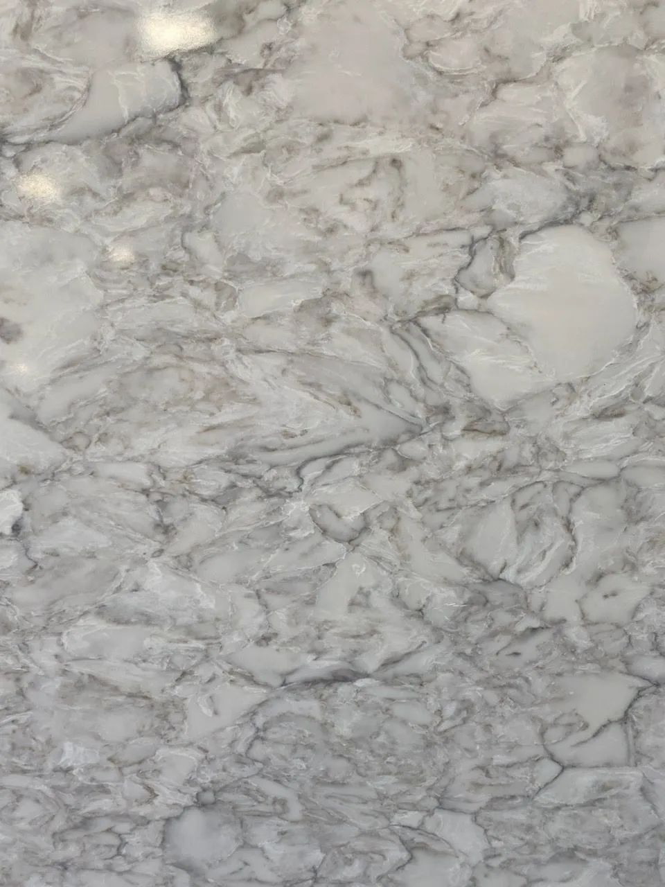 Light gray and white marble or stone surface with veined texture