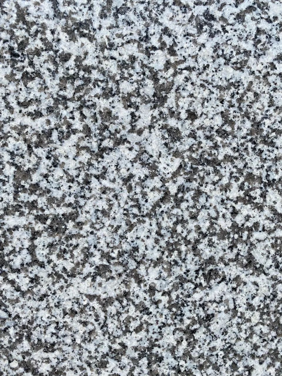 Gray and white speckled granite surface texture