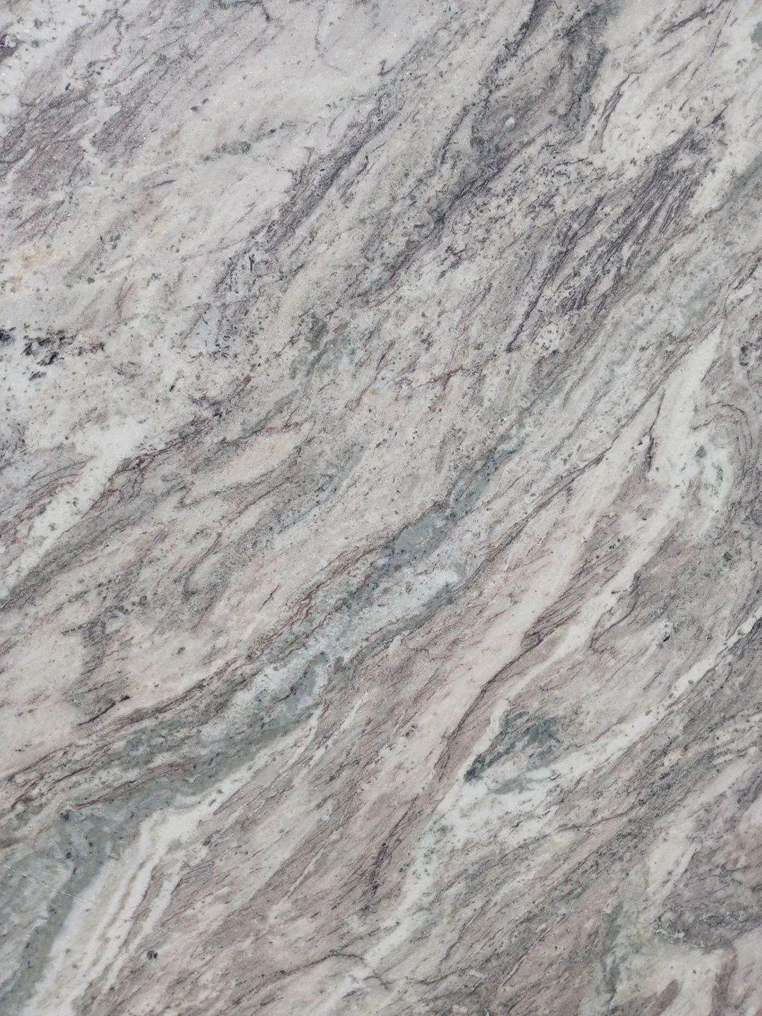 Light gray and white marbled stone surface with diagonal veining