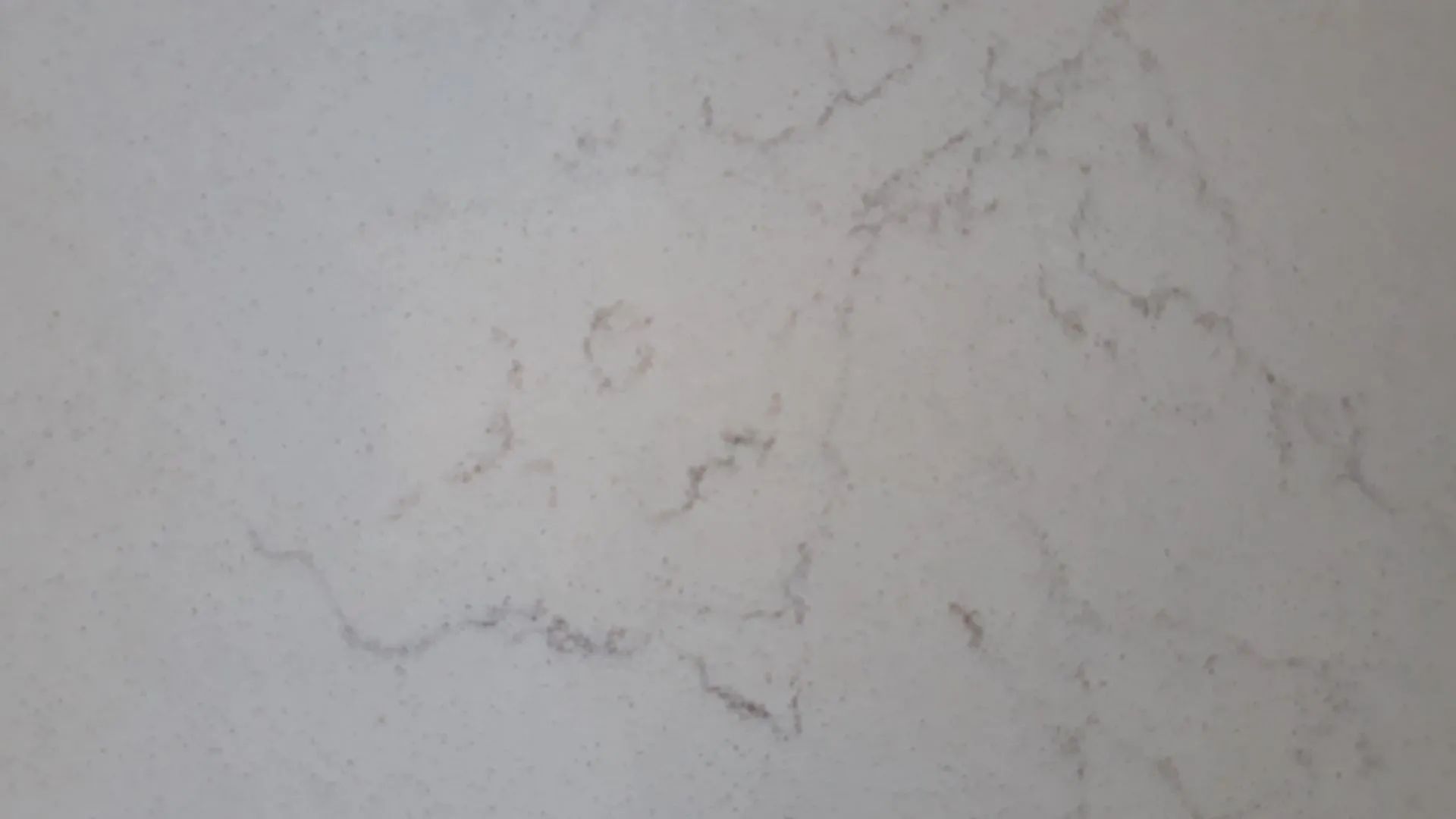 Light gray marble-like surface with faint, irregular veining.