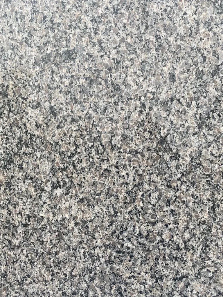 Gray speckled stone or textured surface pattern