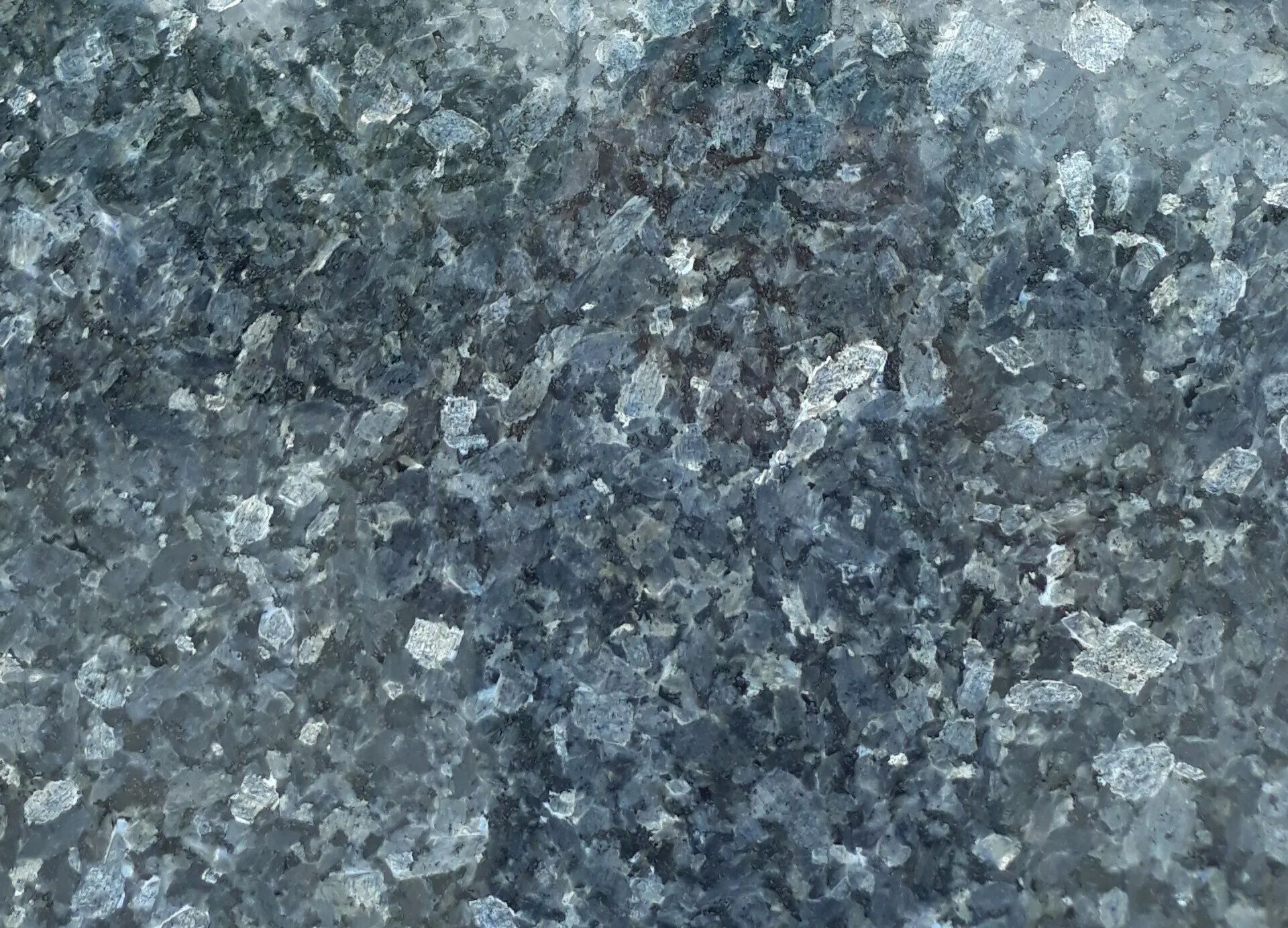 Blue-gray speckled stone surface texture
