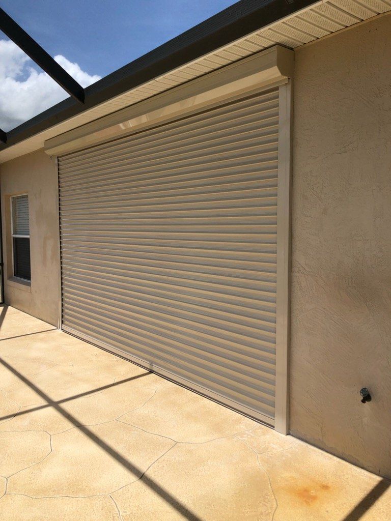 Garage hurricane shutters