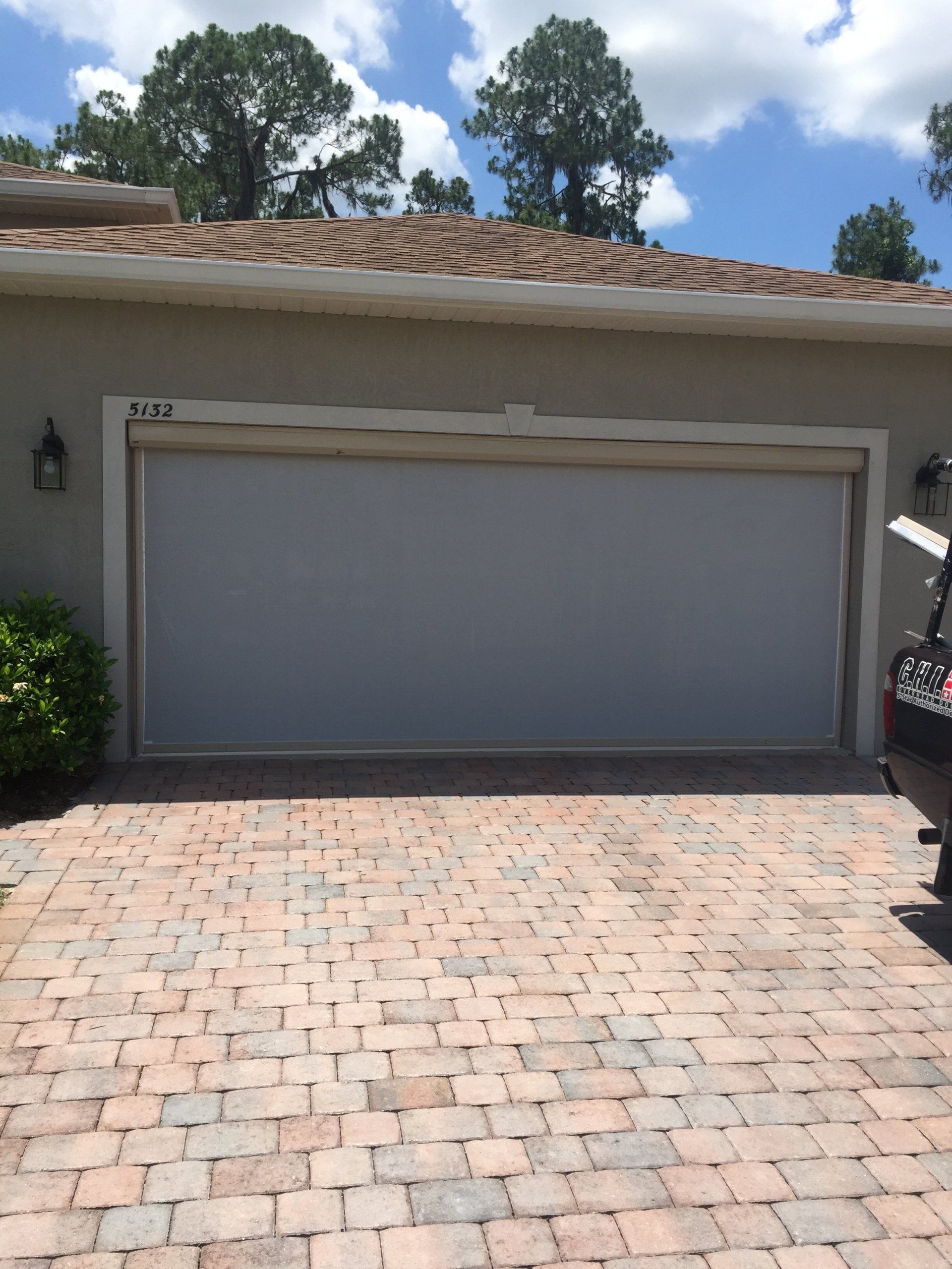 Motorized garage screen