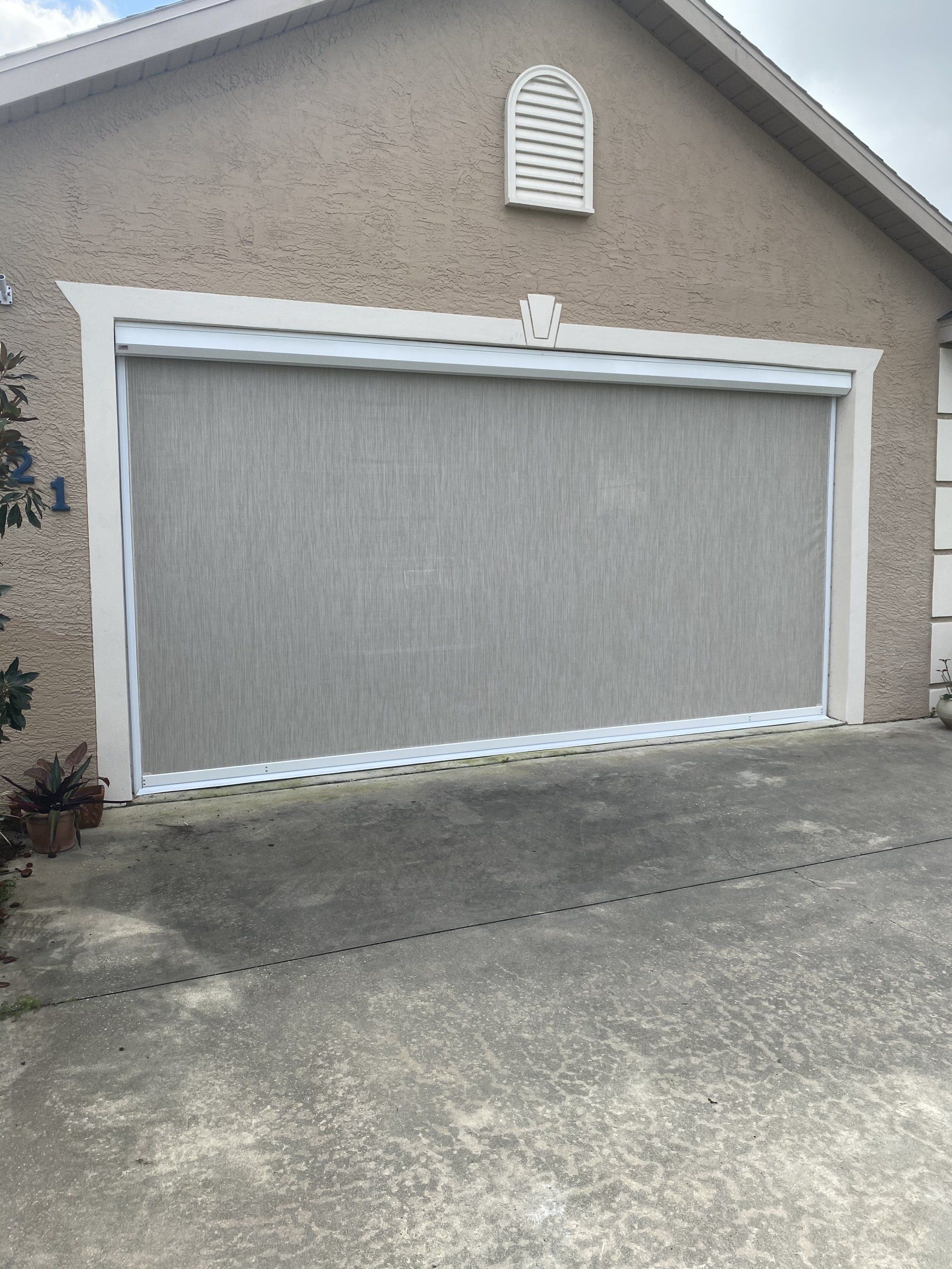 Motorized garage screen