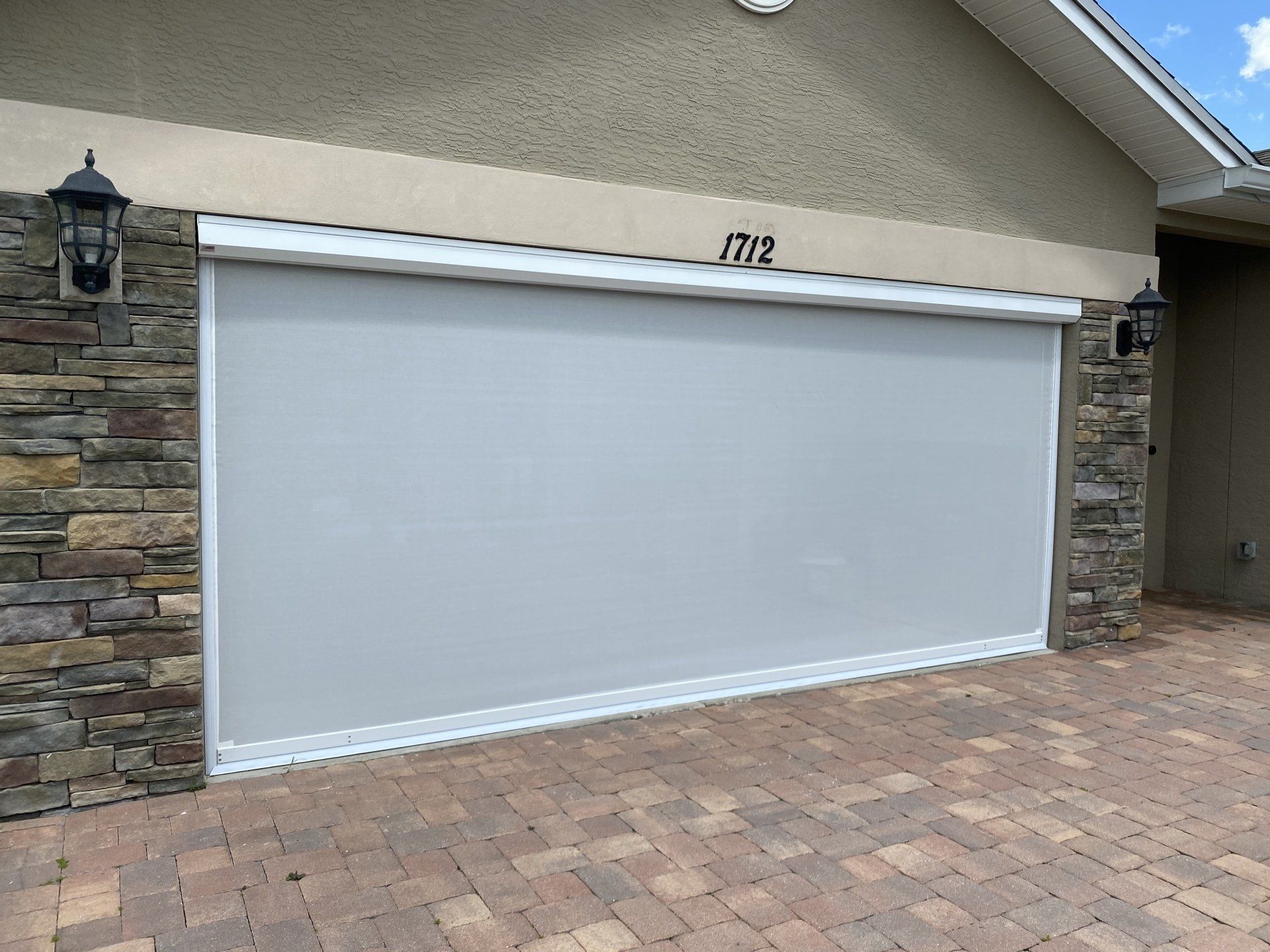 Motorized garage screen