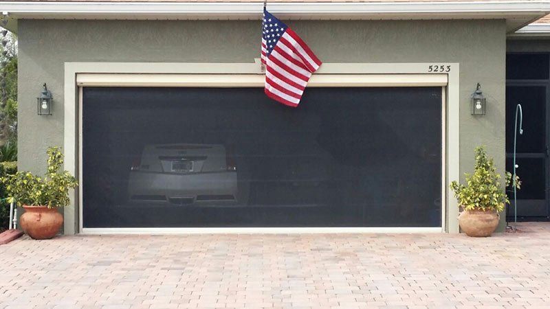 Motorized garage screen