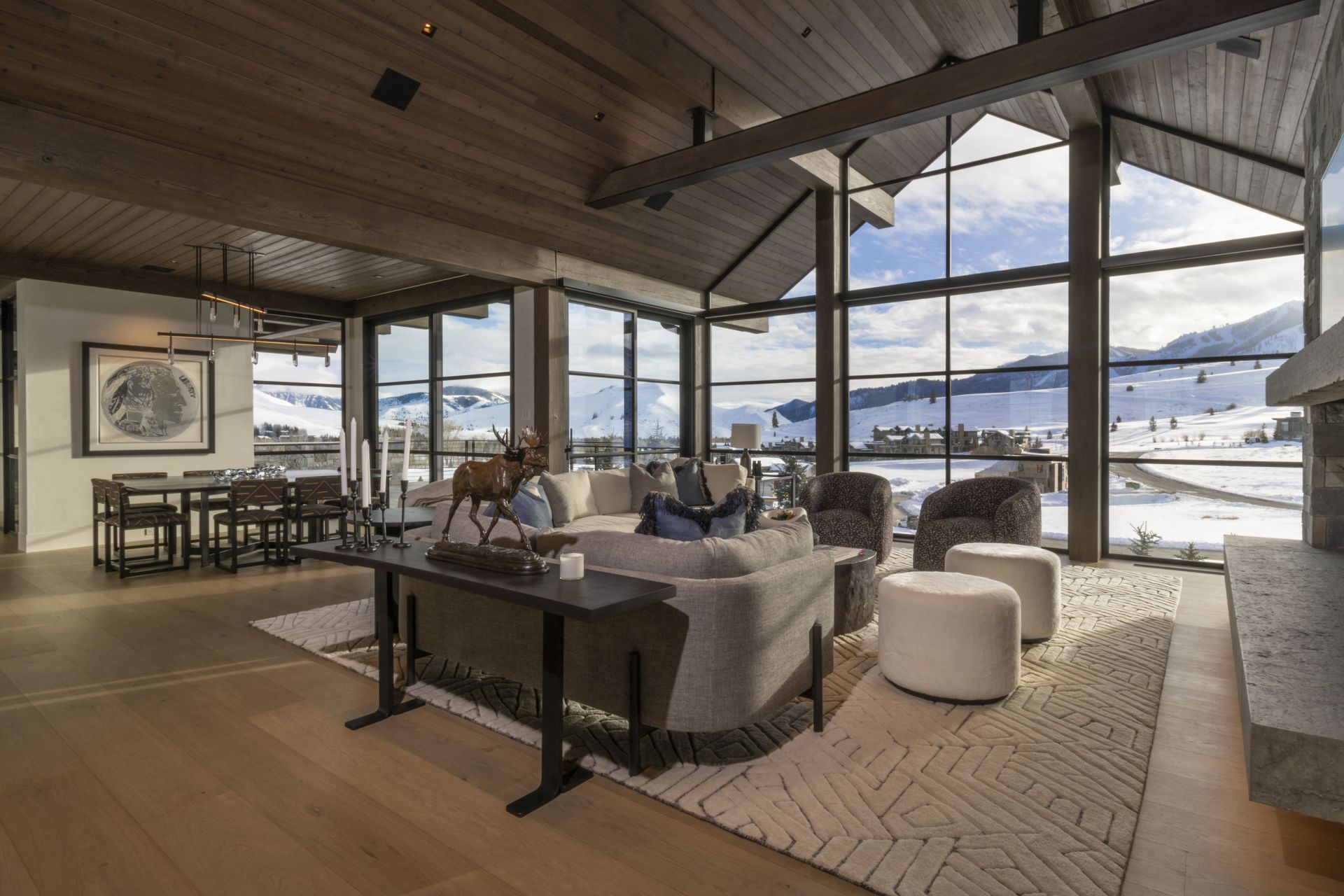 A living room with a lot of windows and furniture