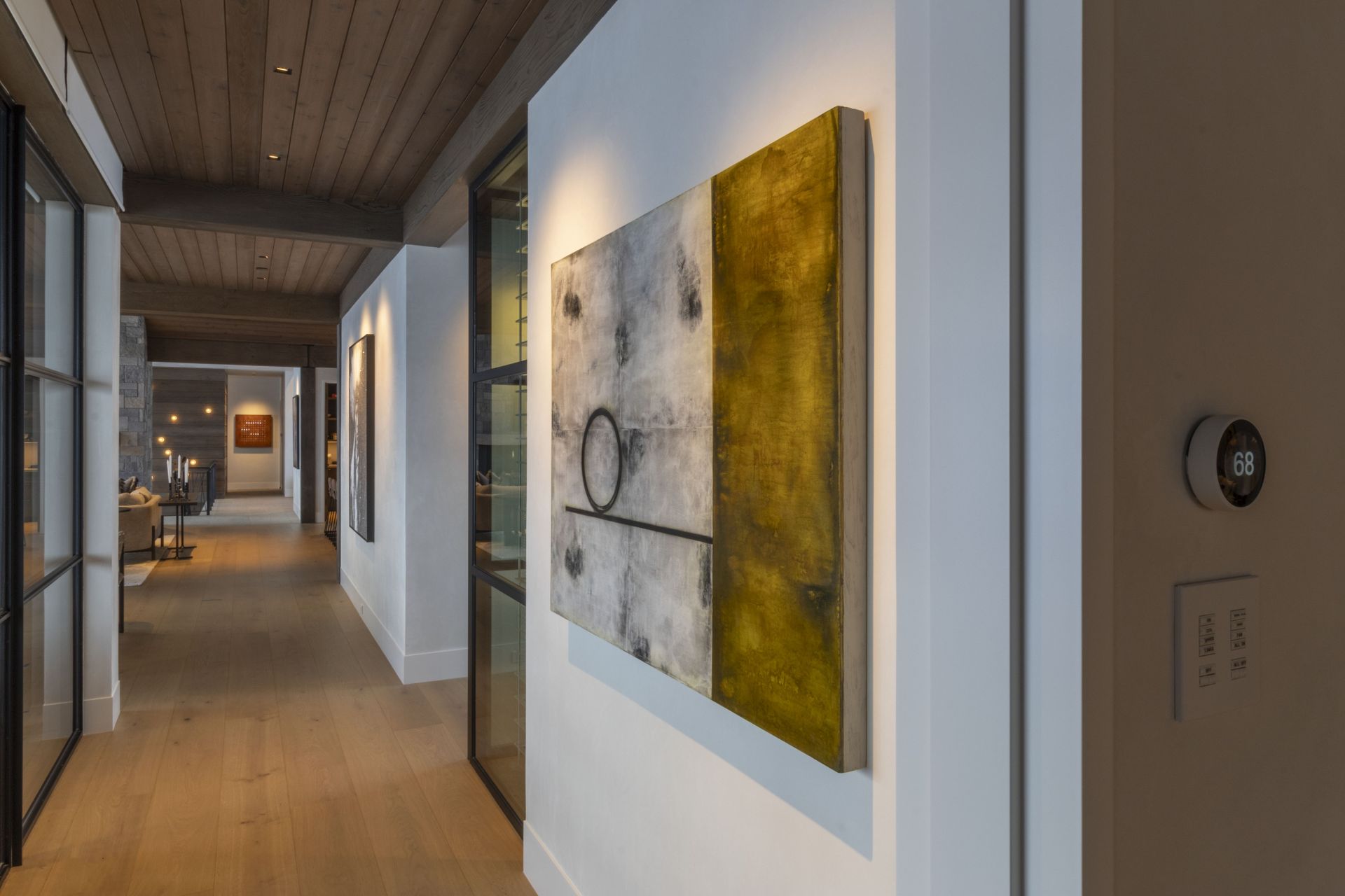 A hallway with a large painting on the wall