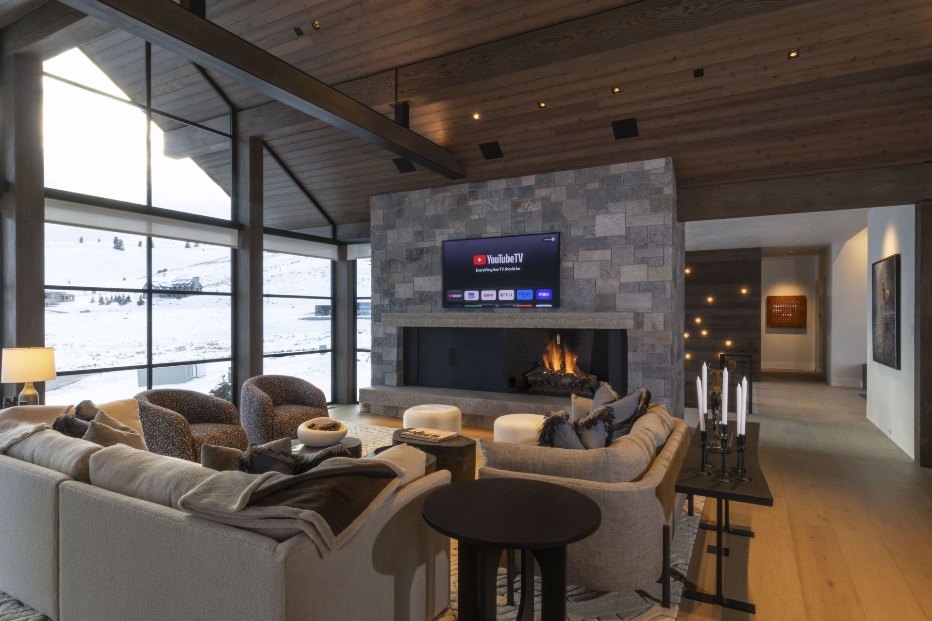 A living room with a fireplace and a flat screen tv