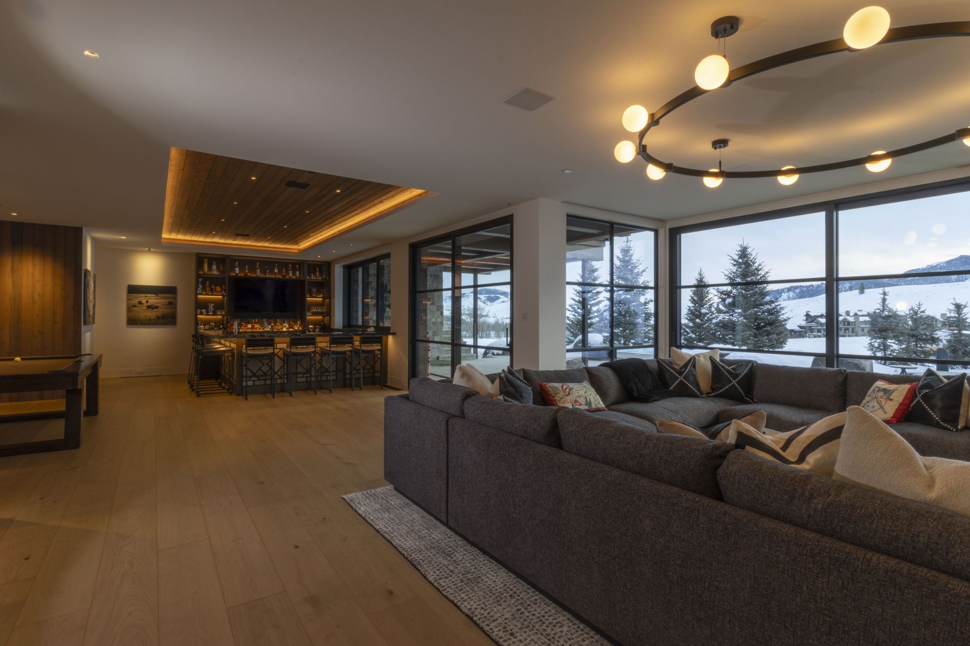 There is a large couch in the middle of the living room