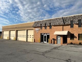 a large brick building with a lot of garage doors