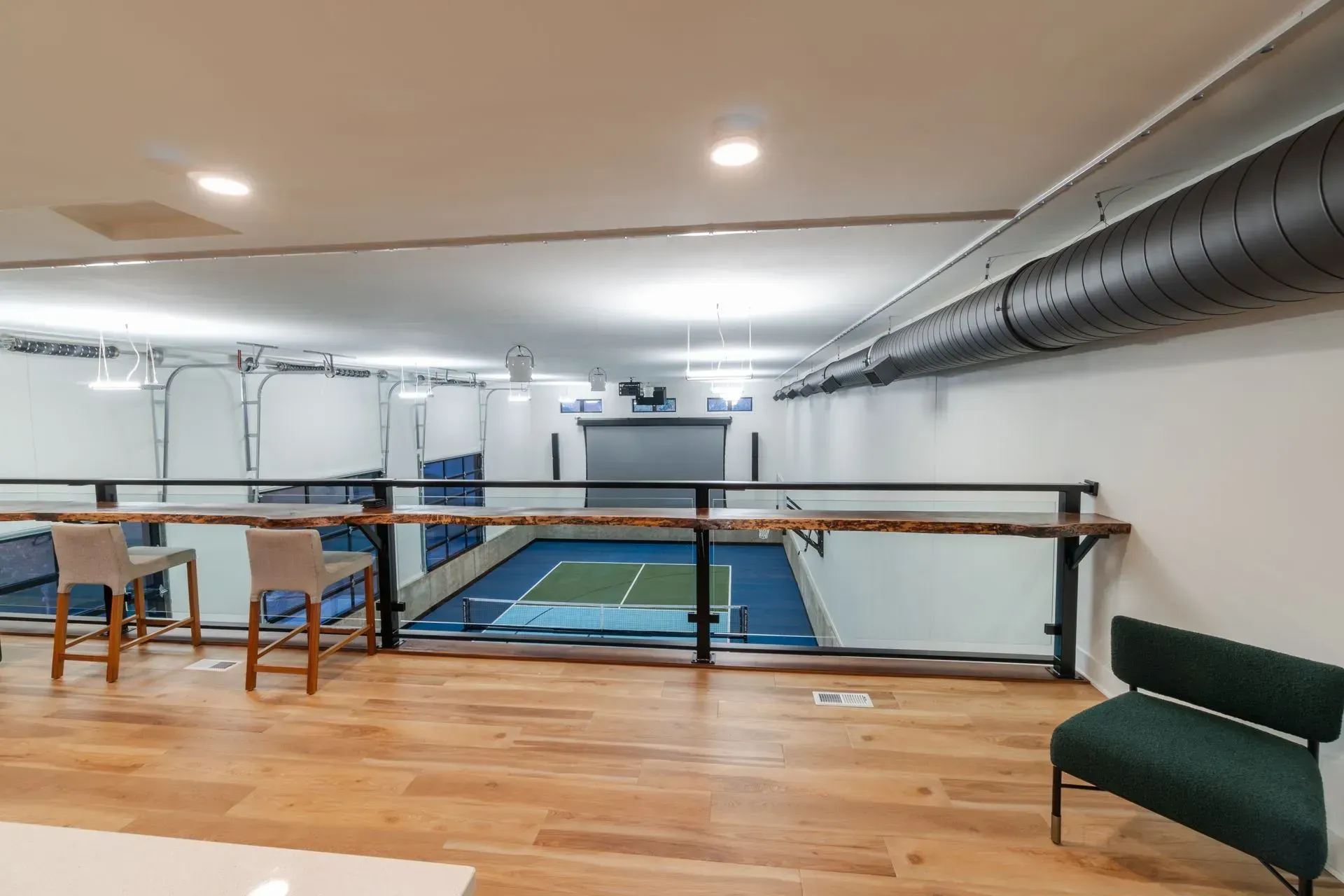 Indoor sports court viewed from above with seating.