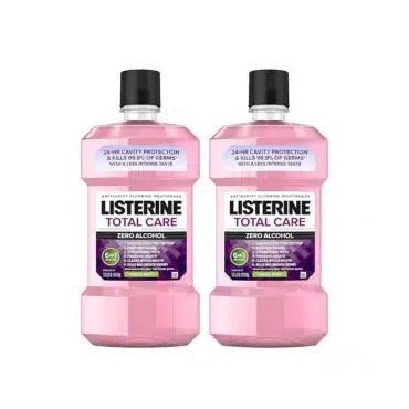 Two bottles of listerine total care mouthwash are sitting next to each other on a white background.