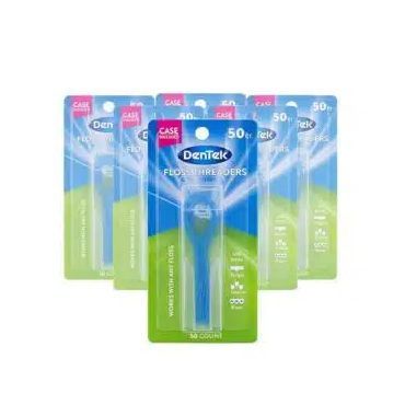 A group of dentek floss holders are sitting on top of each other on a white background.