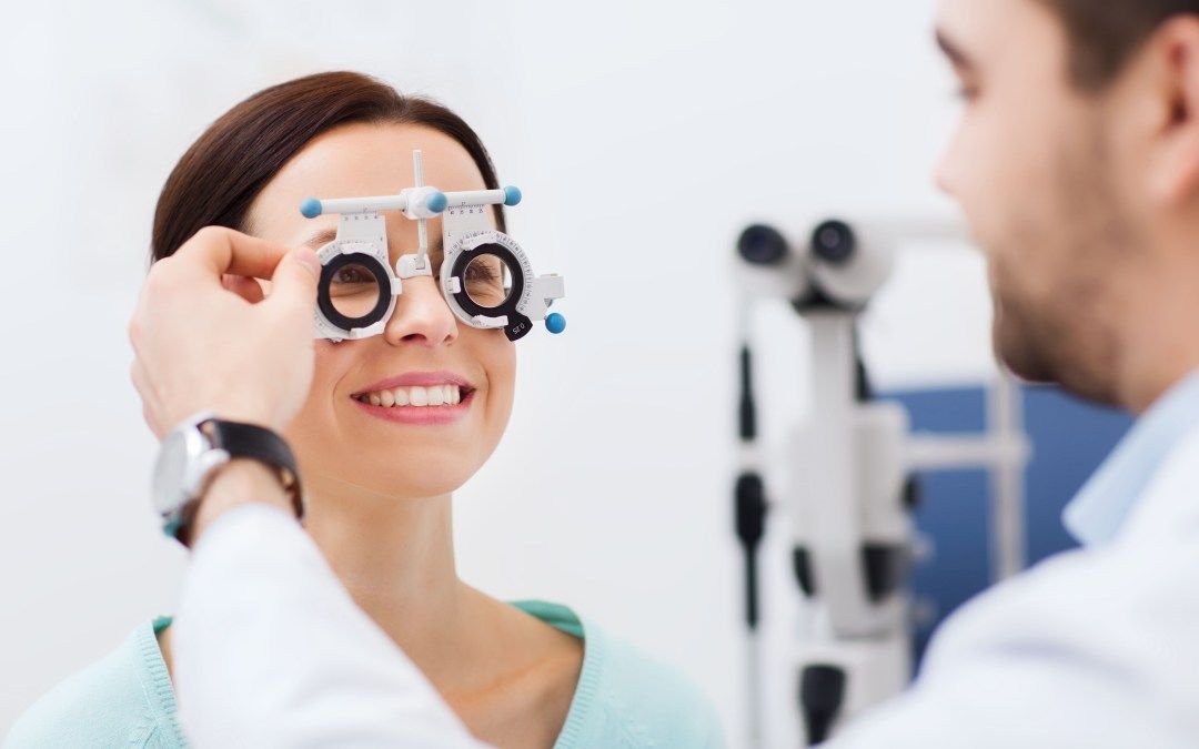 A woman is getting her eyes checked by an ophthalmologist.