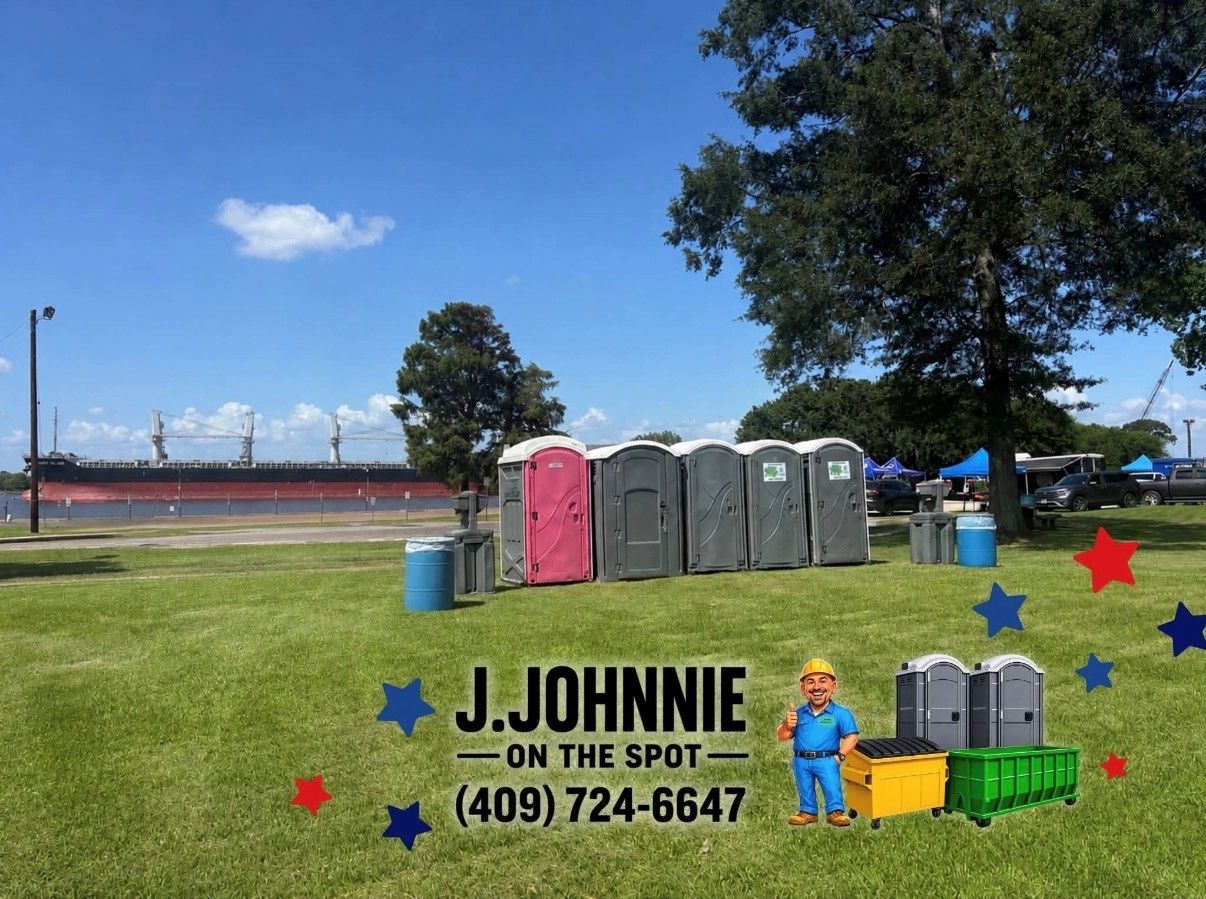 J. Johnnie portable toilets and waste bins on a grassy field under a blue sky, with a phone number sign