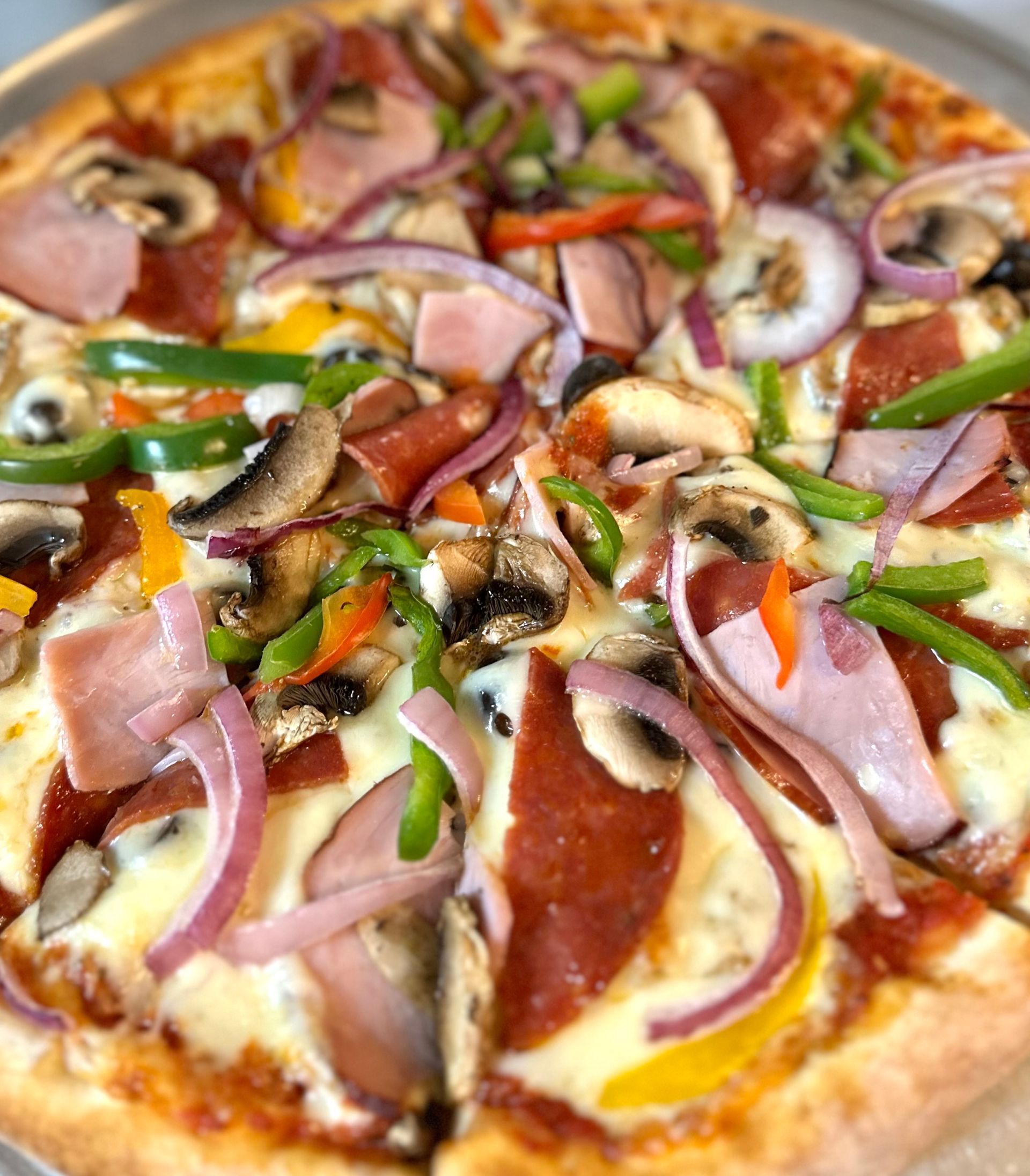 A pizza with a lot of toppings on it