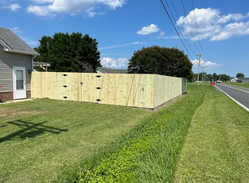 Wooden fence with double gate