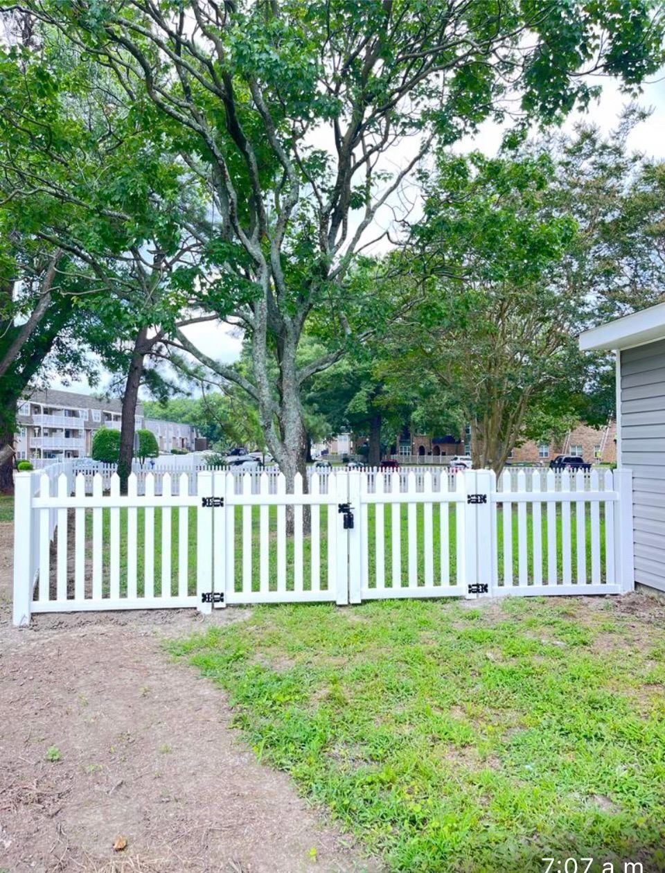 white decorative fence with gate