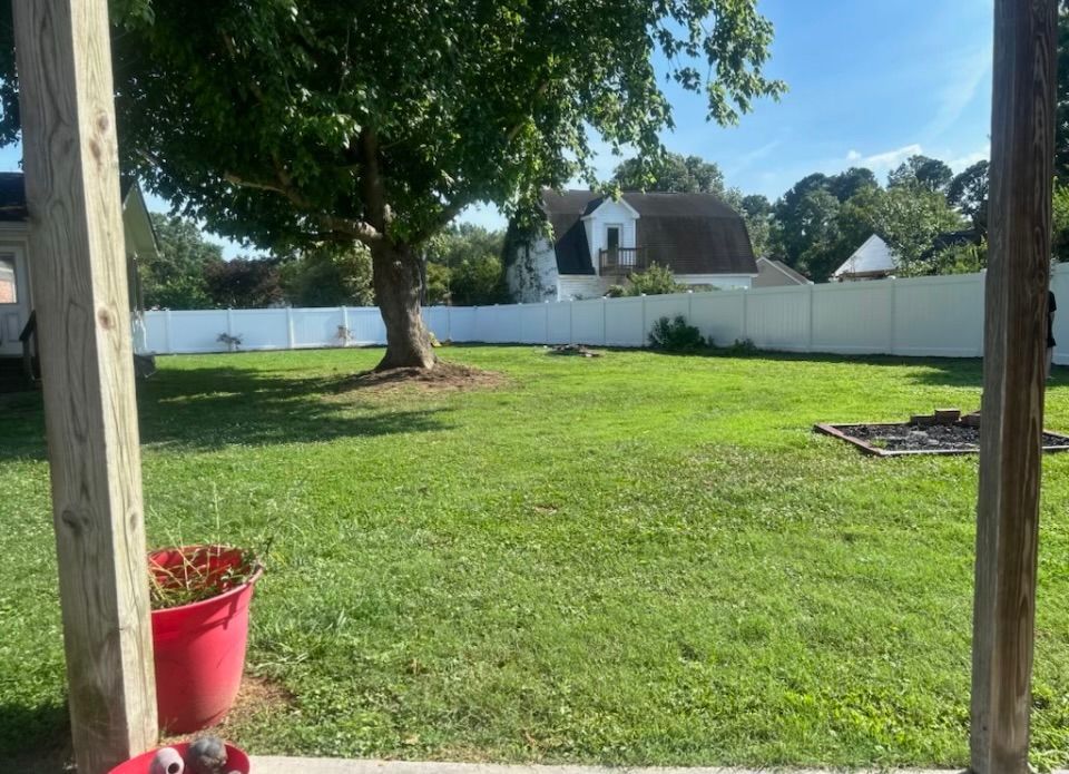 white PVC fence in backyard