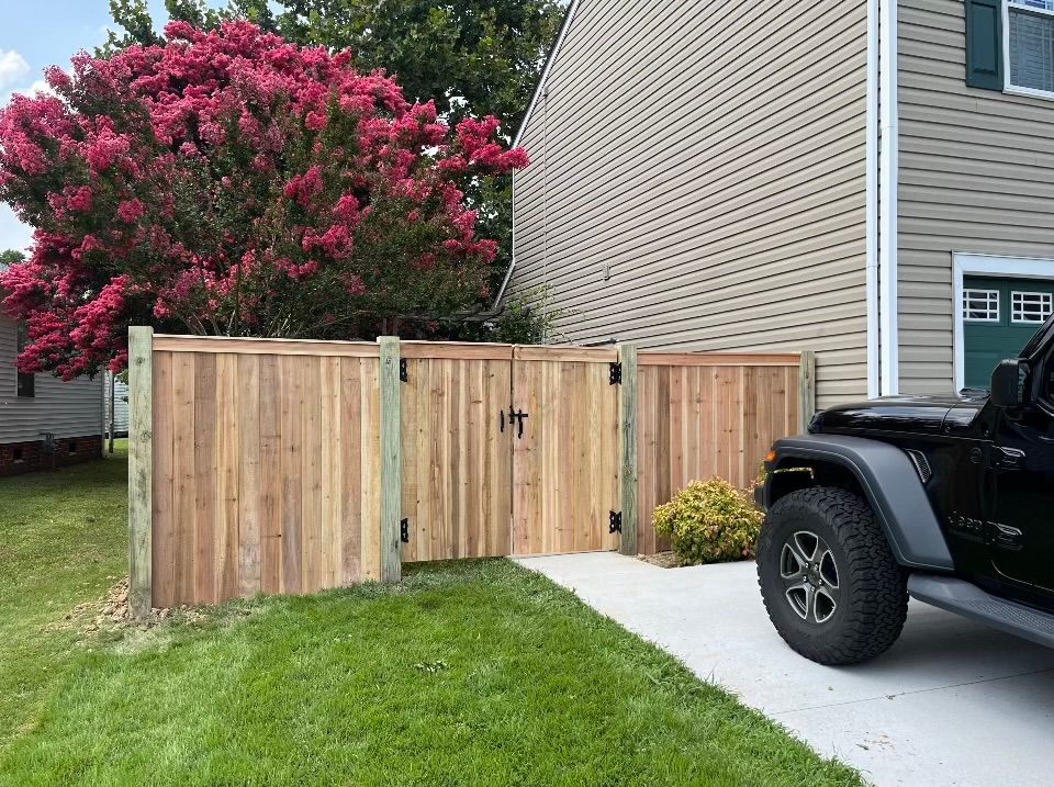 wooden fence by driveway