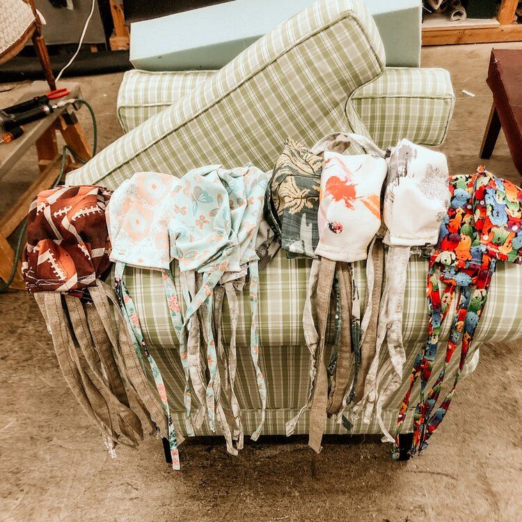 A bunch of face masks are sitting on a chair