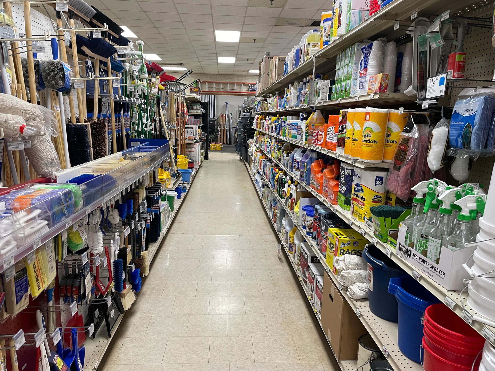 An aisle in a hardware store filled with cleaning supplies
