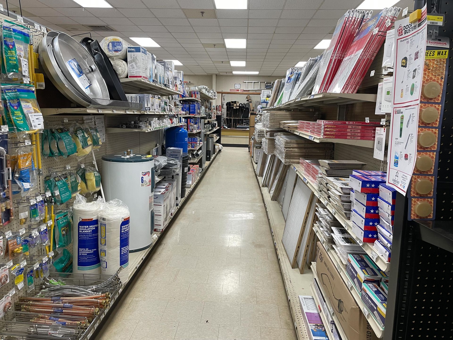 An aisle in a hardware store filled with lots of items