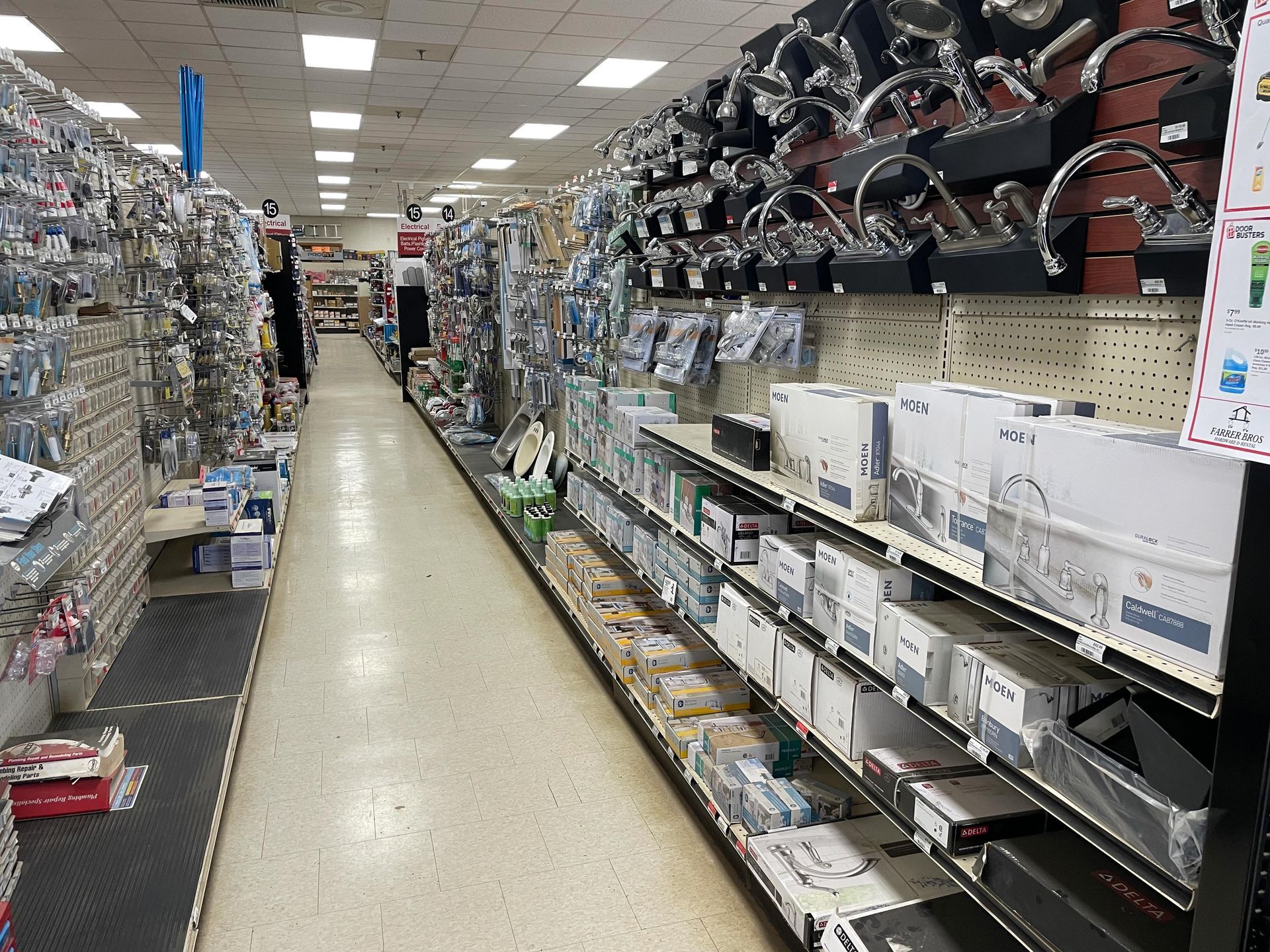 A very long aisle of a hardware store