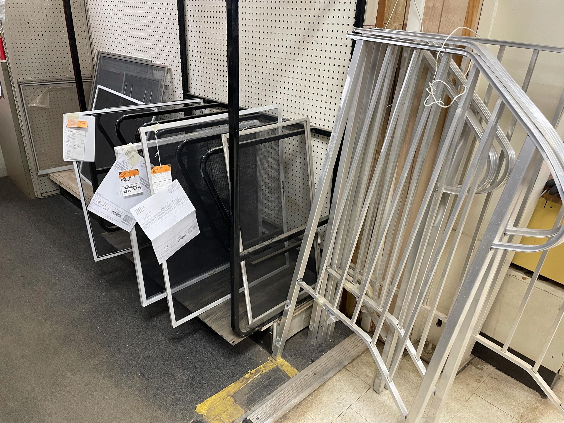 A bunch of metal pieces are stacked on top of each other in a store.