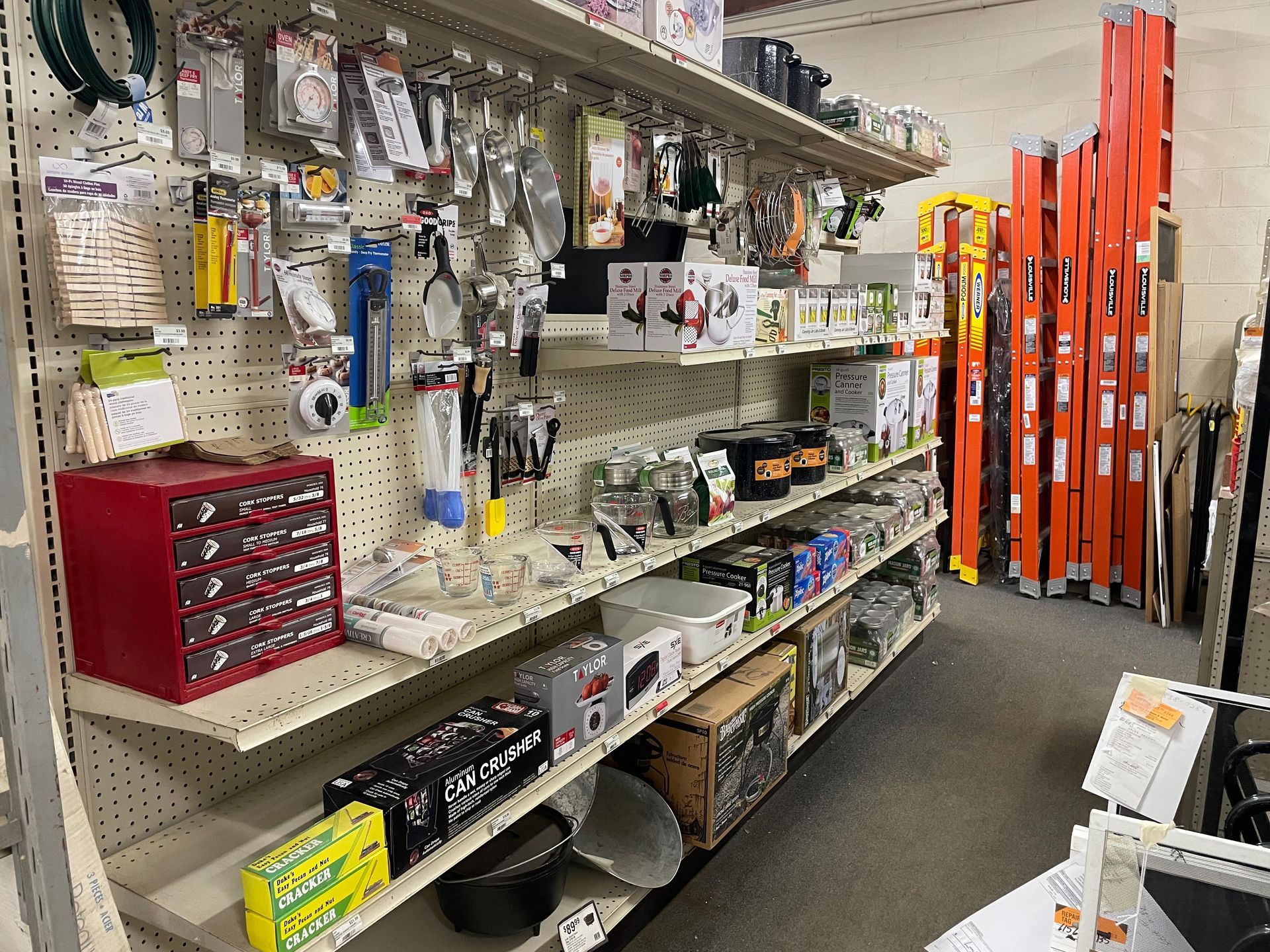 A store filled with shelves filled with lots of tools and boxes.