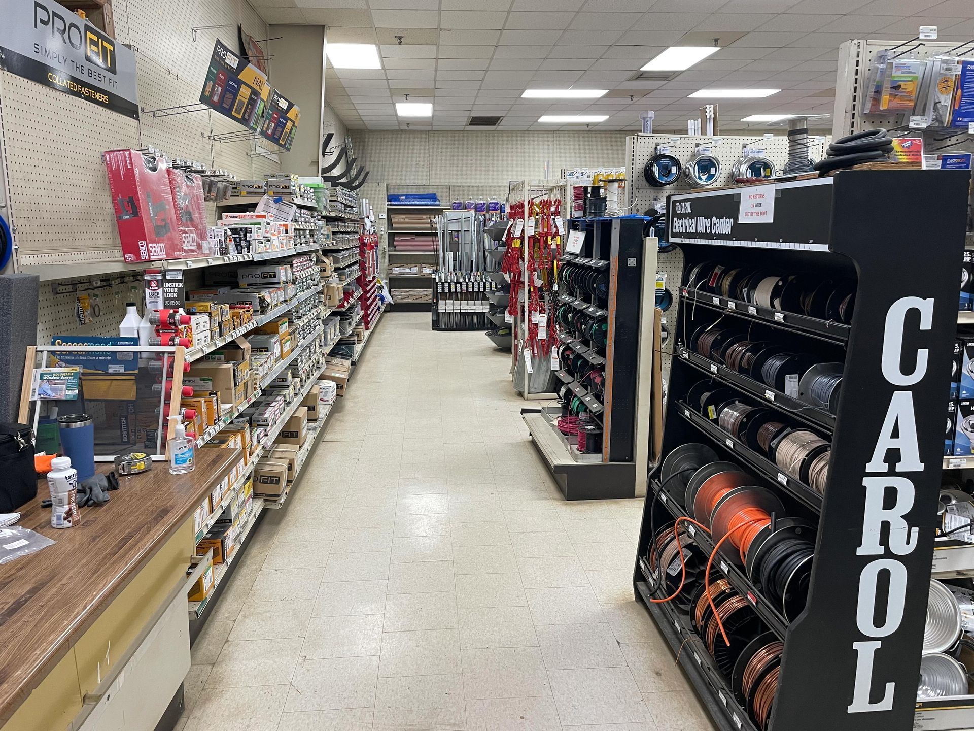 A store aisle with a sign that says carol on it