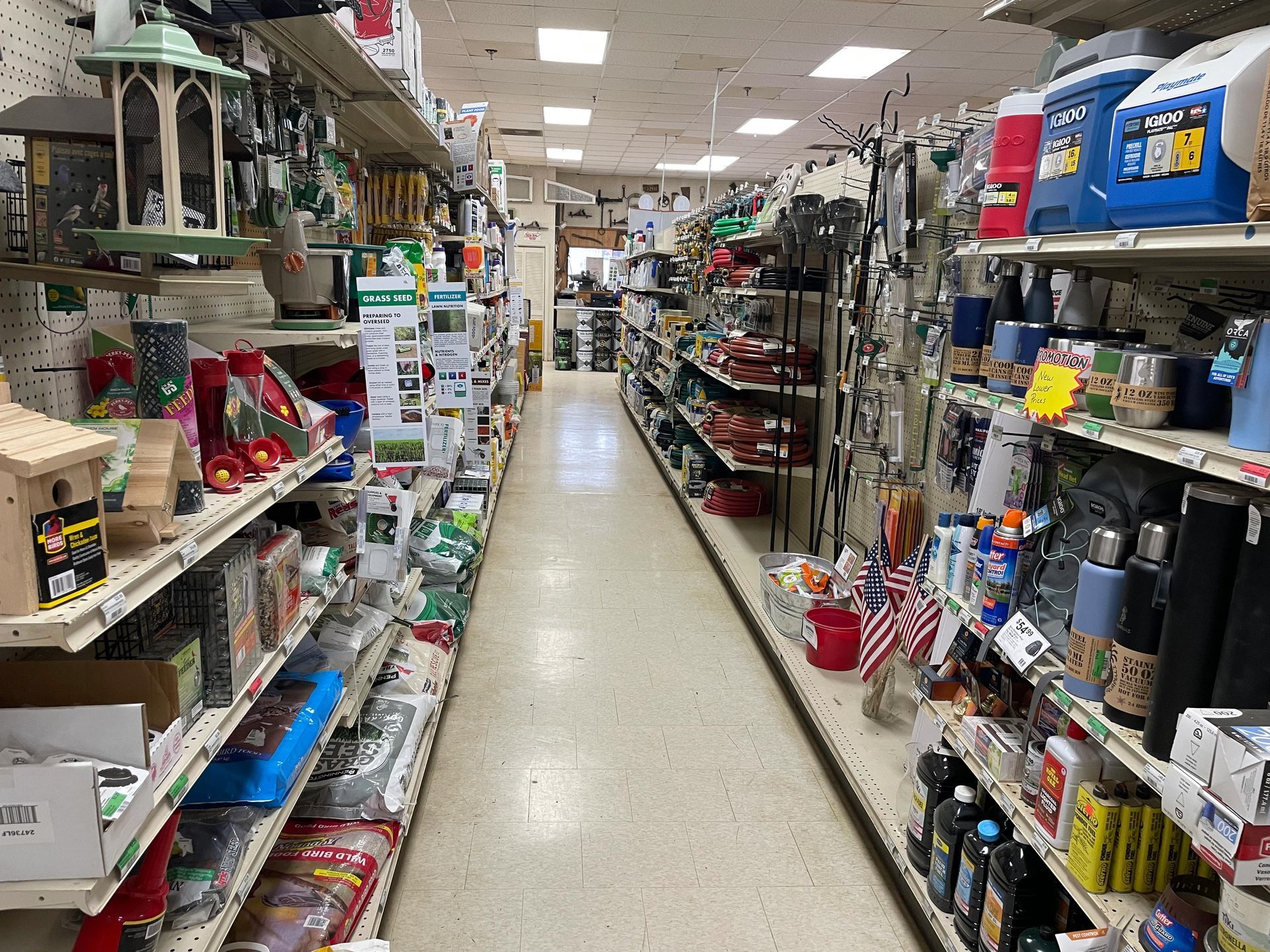 A long aisle in a store filled with lots of products.