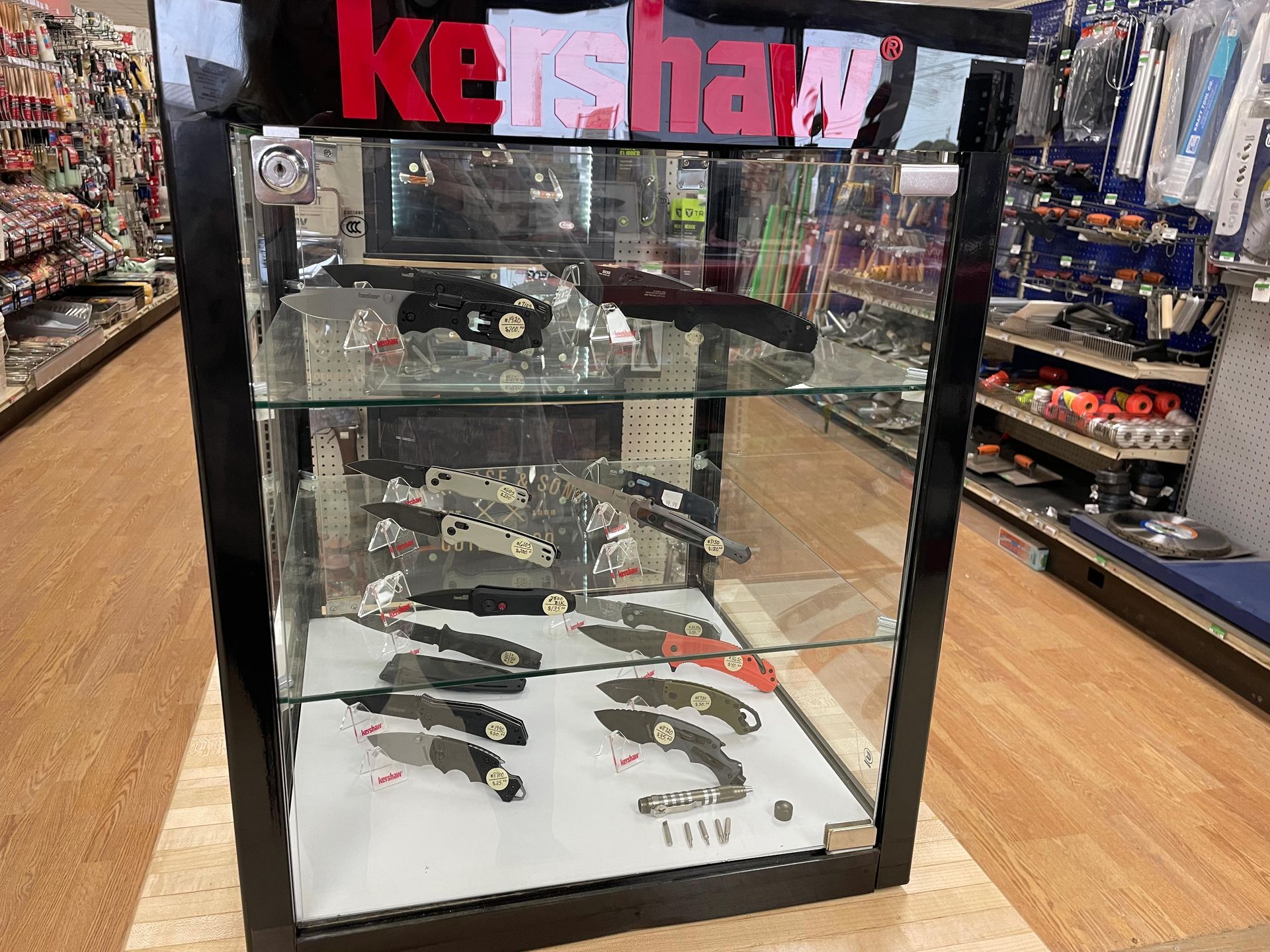 A display case filled with knives in a store.